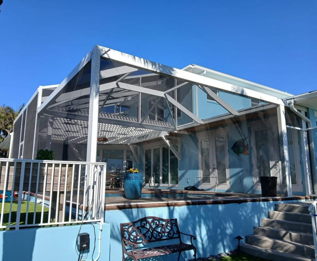 home-2-back-lanai-enclosure Modern aluminum carport in front of a Florida-style home with tropical plants